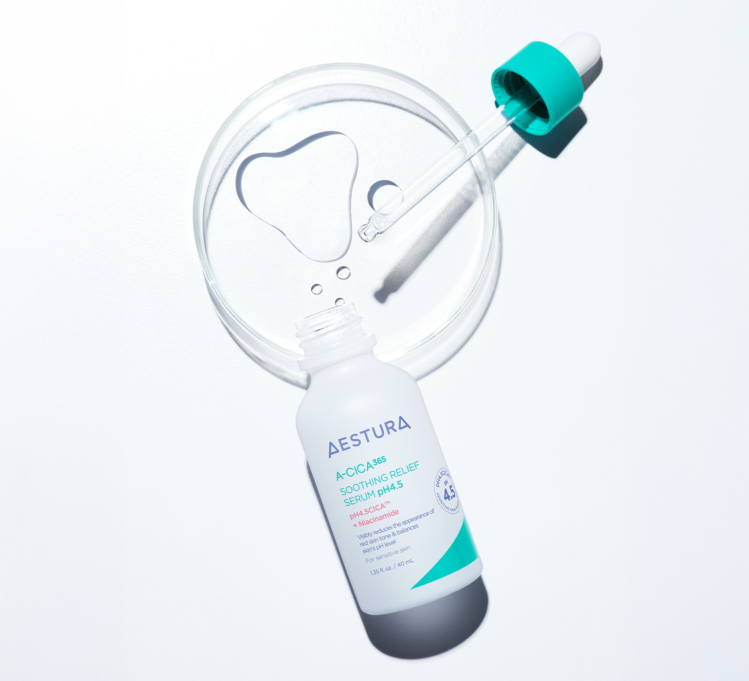 Aestura serum bottle placed on rippling water