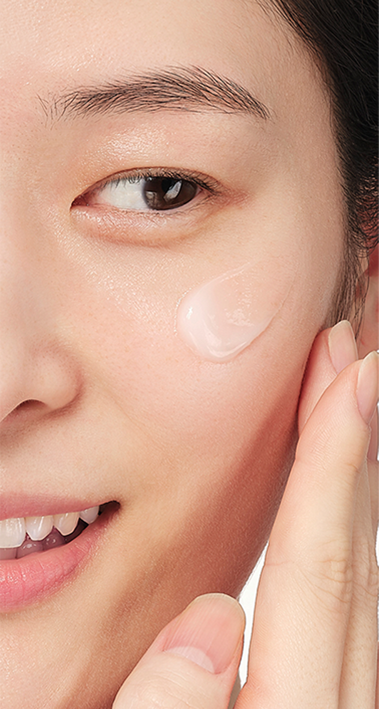 Close-up of Aestura cream being applied on the face