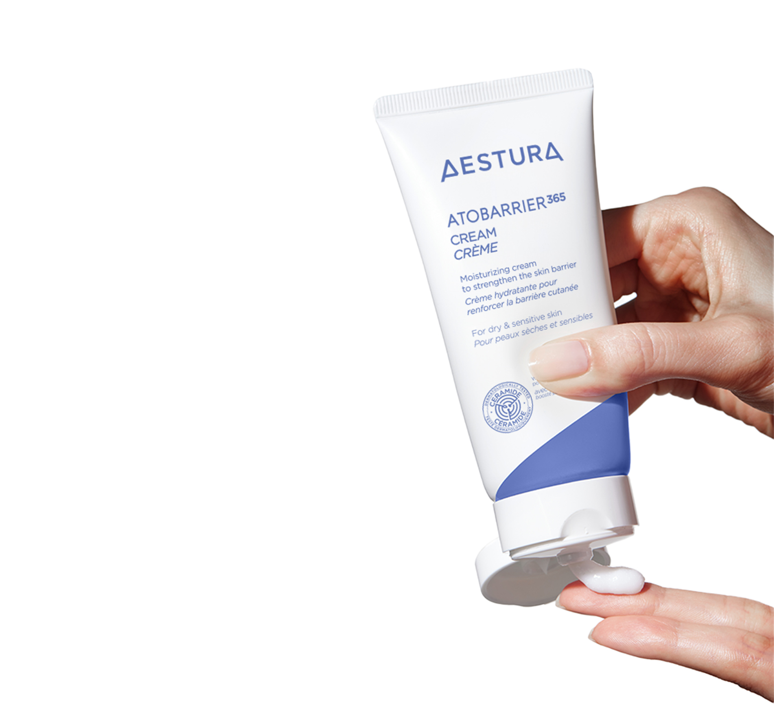 applying Aestura ATOBARRIER365 CREAM onto hand for skincare routine