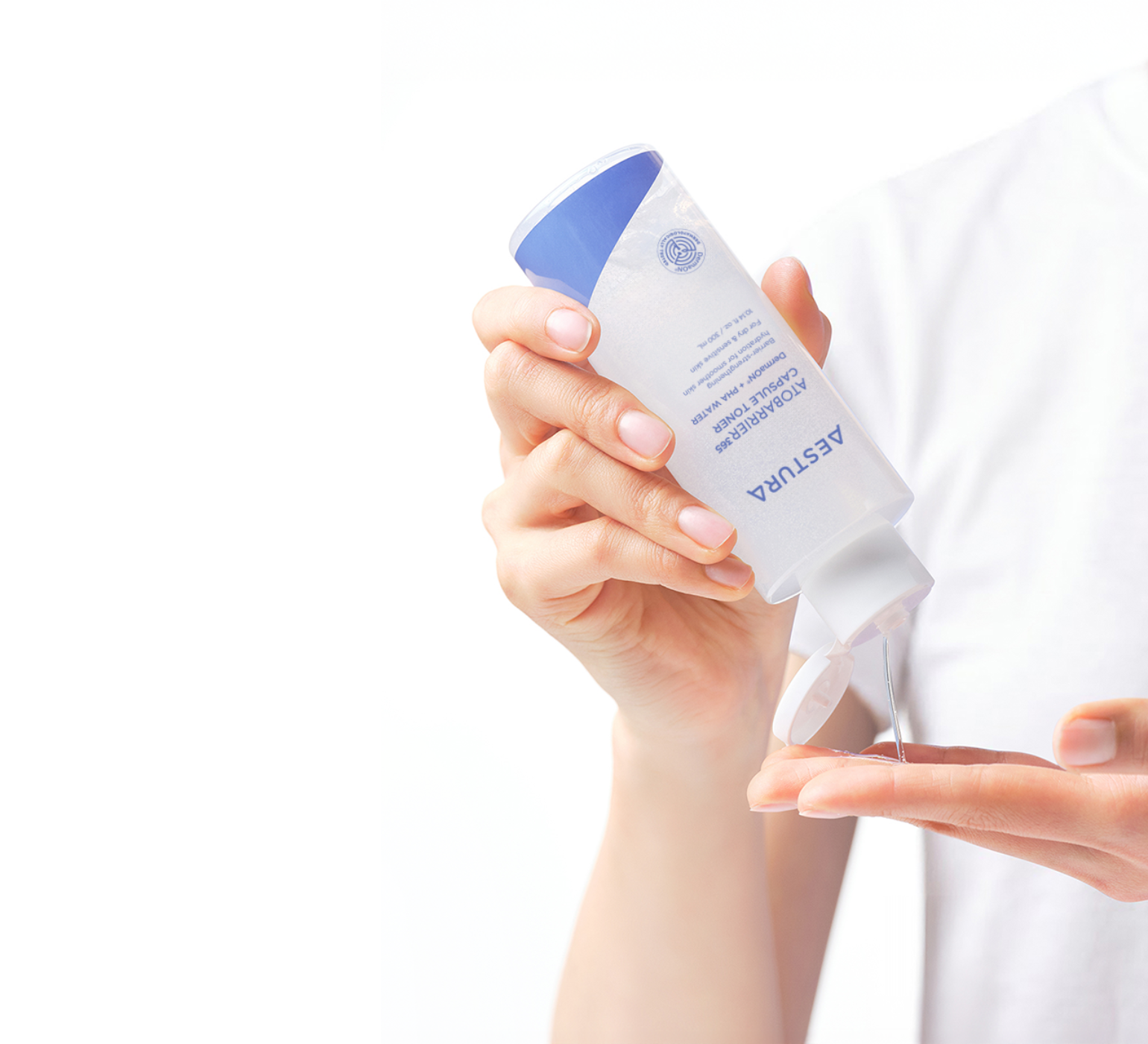 applying Aestura ATOBARRIER365 CREAM onto hand for skincare routine	