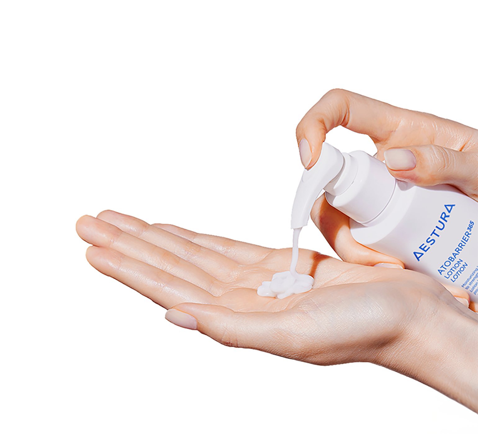 Dispensing Aestura Atobarrier365 Lotion onto the palm, showing creamy texture
