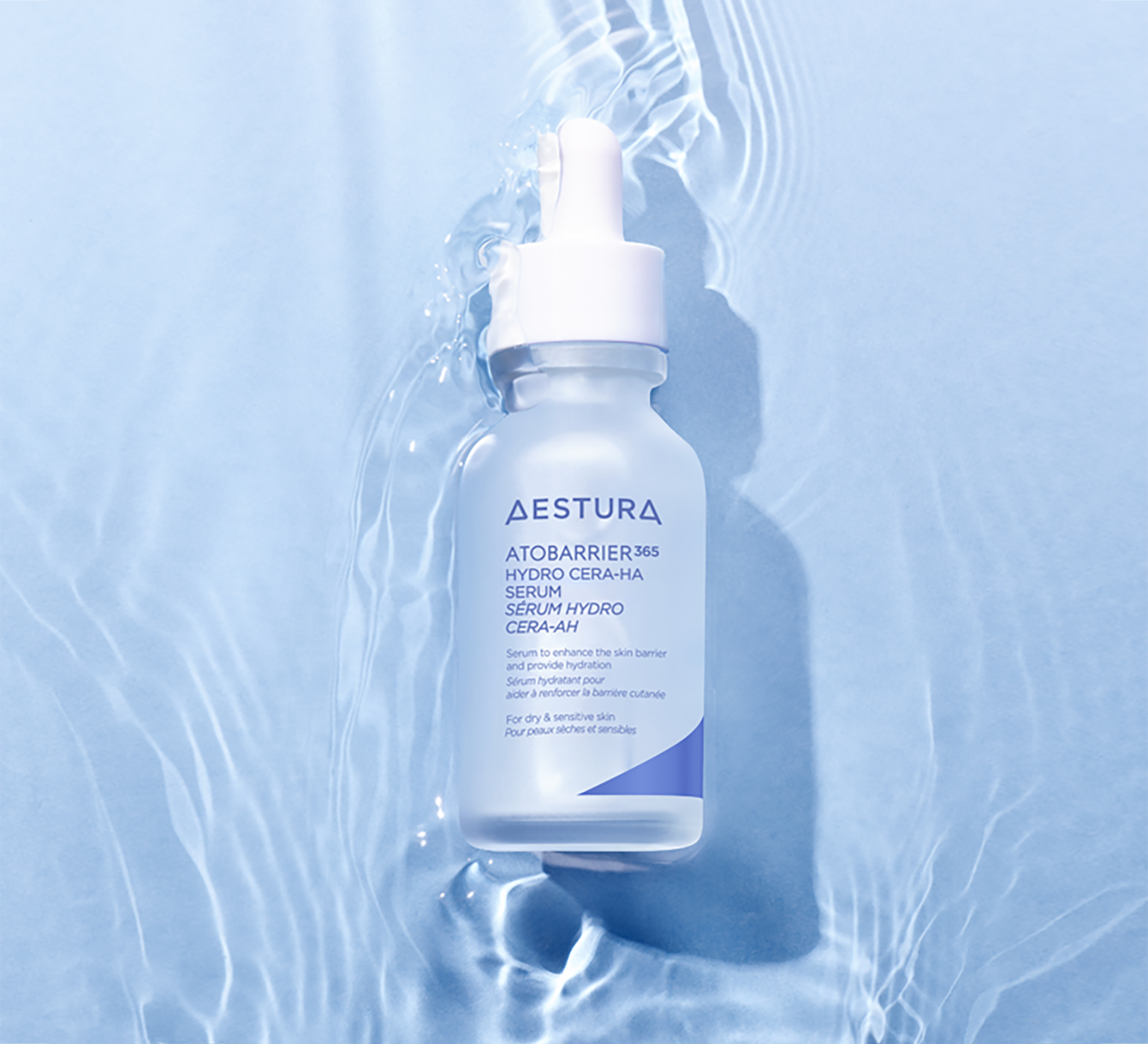 Aestura serum bottle placed on rippling water