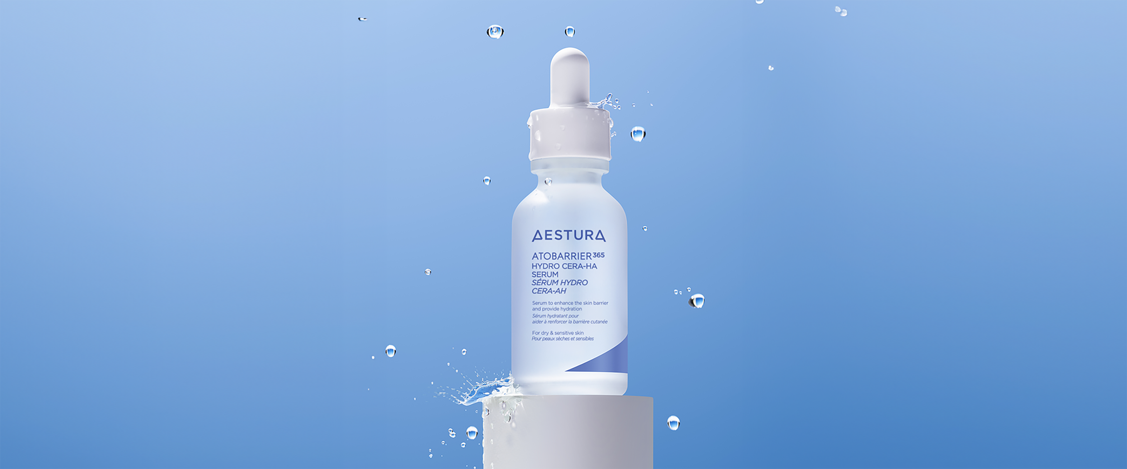 Aestura Atobarrier365 Hydro Cera-HA Serum bottle on a pedestal with water splash effect, emphasizing hydration