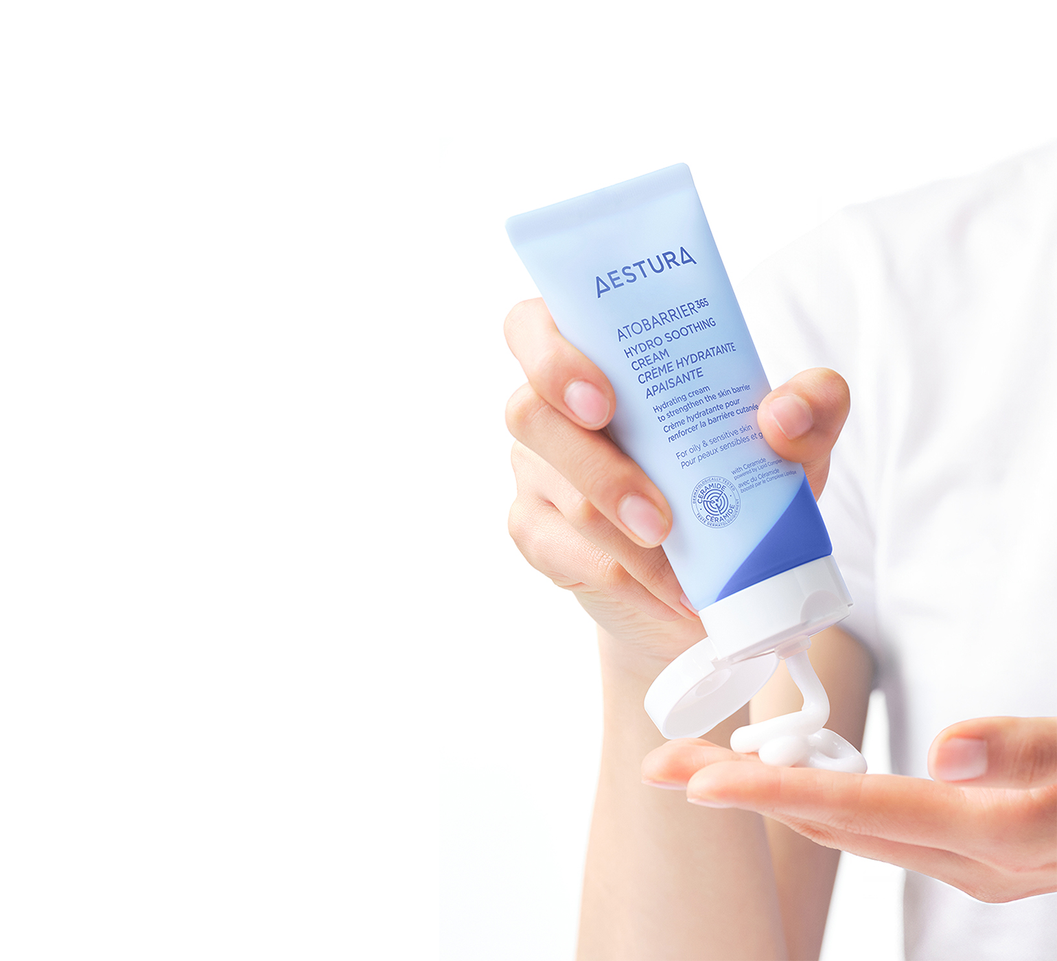 applying Aestura ATOBARRIER365 CREAM onto hand for skincare routine	