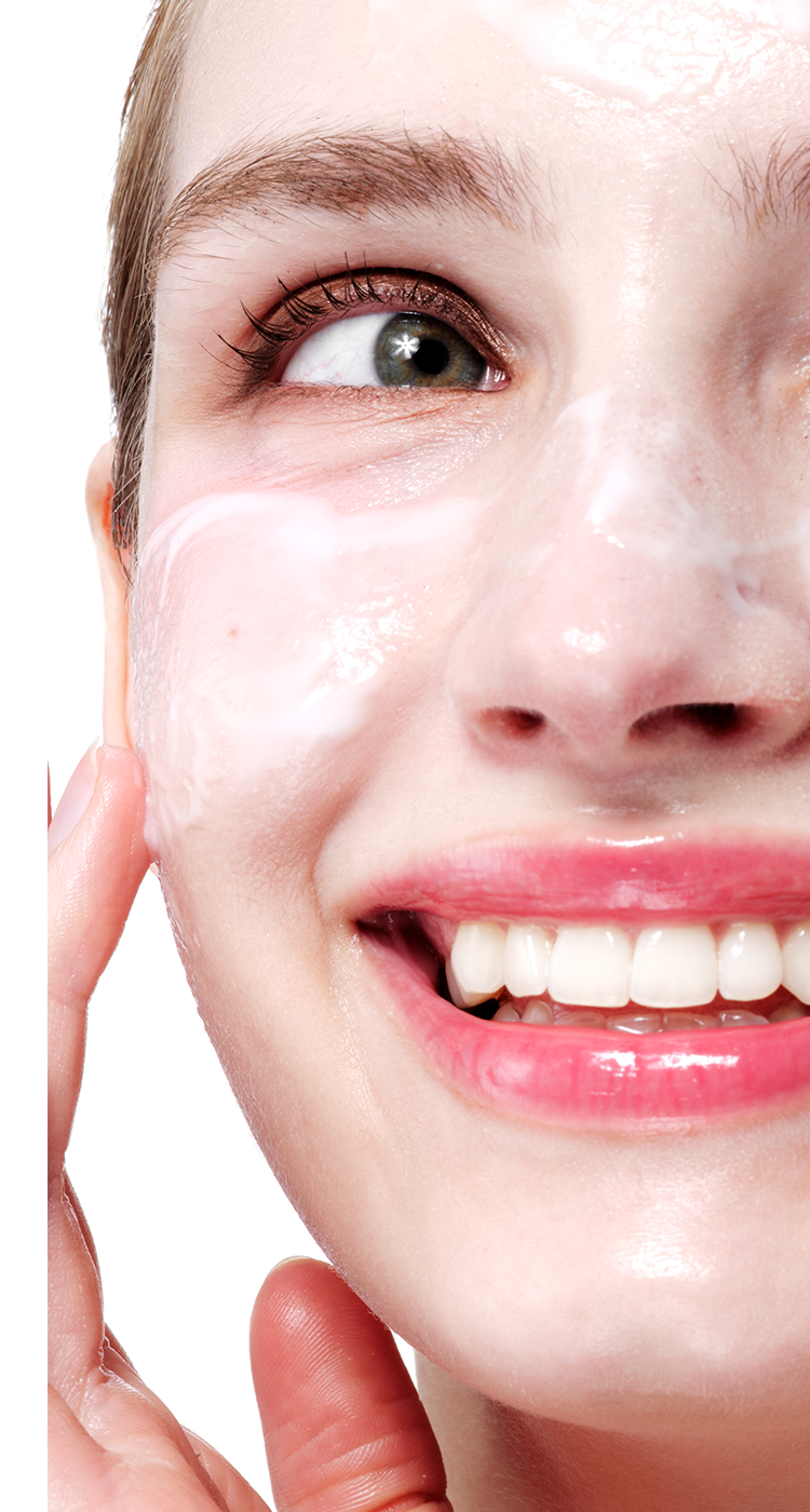 Close-up of Aestura cleanser being applied on the face