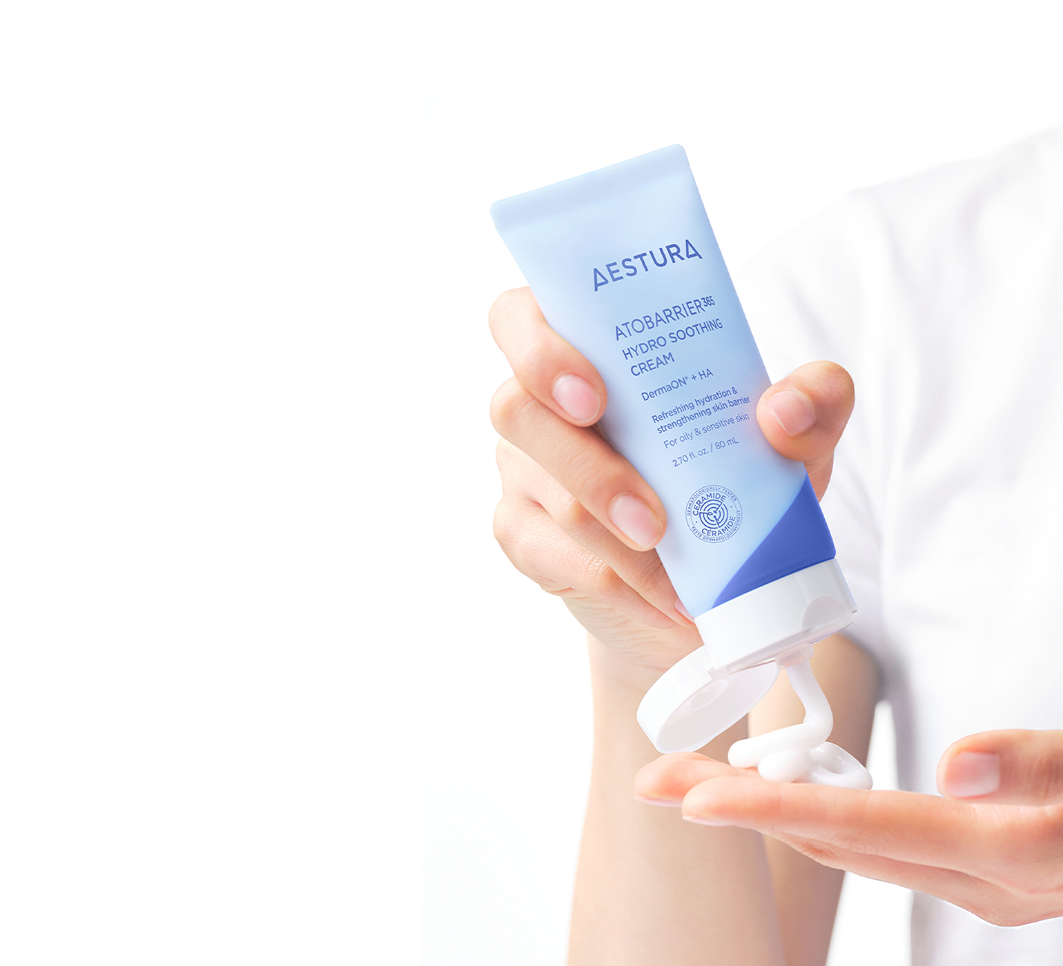 applying Aestura ATOBARRIER365 CREAM onto hand for skincare routine	